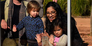 Carolina Holland,with her children Enzo (left) and Lourdes,look at meerkats at Taronga Zoo.