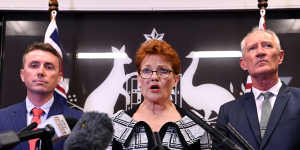 One Nation leader Pauline Hanson,flanked by party officials James Ashby (left) and Steve Dickson on Thursday.