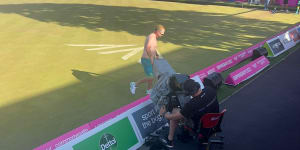Aaron Wilson rips off his shirt after winning the men’s lawn bowls singles titles in Birmingham.