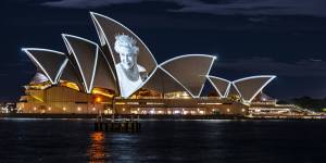 An image of Queen Elizabeth II is projected onto the sails on the day of her death in 2022. 