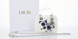 A limited-edition Dior handbag purchased with stolen funds by Melissa Caddick sold at auction for $7364.