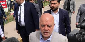 Iraq Prime Minister Haider al-Abadi speaks to reporters after casting his ballot in the country's parliamentary elections in Baghdad on Saturday.