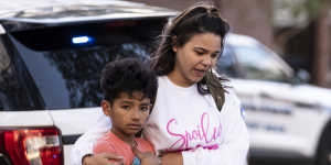 A fourth-grader leaves Richneck Elementary School with his mother after the shooting.