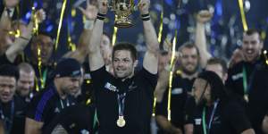 Winners:New Zealand's captain Richie McCaw holds up the World Cup.