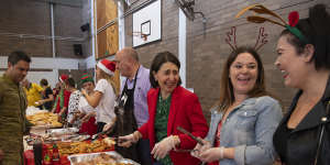 NSW Premier Gladys Berejiklian serving breakfast to RFS volunteers at Colo Heights High School on Christmas morning. 