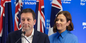 Matthew Guy with wife Renae as he concedes defeat on Saturday.