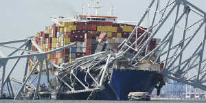 Cargo ship Dali stuck under a piece of the collapsed Francis Scott Key Bridge.