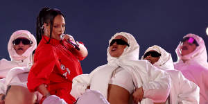 Rihanna and her merry band of Michelin Men.