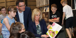 Daniel Andrews,as state opposition leader in 2014,watches his wife,Catherine,reading to children at the State Library. Where might he start reading now that he’s resigned as premier? 