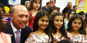 Dutton with Dima Hamkna,10,Natalie Mirza,10 and Cassandra Mirza,9,at Wagga Wagga. 