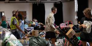 Mullumbimby locals manage donated goods for flood victims in March last year.