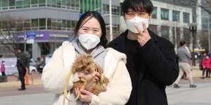 Lee Yeun-hee,33,a pre-school teacher,and her husband Kim Beom-jin,34,an office worker joined the campaign rally on Tuesday.