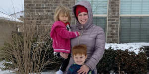 Rebekah Sawyer with children Wyatt and Emma outside their home in Fort Worth,Texas.