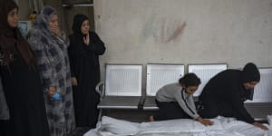 Palestinians mourn their relatives killed in the Israeli bombardment of the Gaza Strip,at the hospital Rafah,southern Gaza,on Thursday.