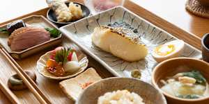 The Japanese breakfast set includes grilled fish,rice,soup,something fried,something grilled,a little sashimi and pickles.