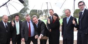 In 2013,then premier Barry O'Farrell and Gladys Berejiklian turn a sod to mark the signing of contracts for the metro line. 