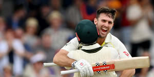 Mitchell Marsh celebrates with Travis Head after reaching his century during day one of the third Ashes Test at Headingley.