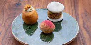 Pani puri filled with duck parfait and raspberry,duck katsu sandwich,and a doughnut cooked in duck fat. 