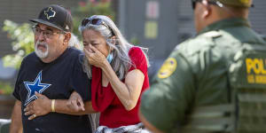 A woman cries as she leaves the Uvalde Civic Centre.