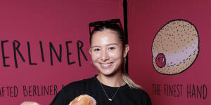 Angela Pidgeon with a rhubarb and custard-filled doughnut at Berliner Bakery.