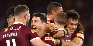 Ben Hunt is mobbed after his series-sealing try.