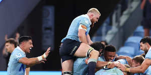 The Waratahs celebrate their 43-30 win over the Crusaders. 