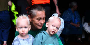 Gabby Thatcher with her sons Elijah and Lachlan in the evacuation centre.