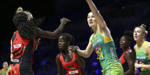 Australia's Courtney Bruce takes on Malawi's Thandie Galleta in yet another lopsided win for the Diamonds in Liverpool.