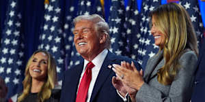 Donald Trump celebrates his victory flanked by daughter-in-law Lara Trump (left) and his wife,Melania.