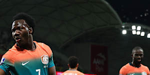 Nestory Irankunda of Australia throws on a silver glove and performs a Michael Jackson dance after scoring on Tuesday night.