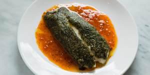 Herb-crusted coral trout with roast tomato sauce.