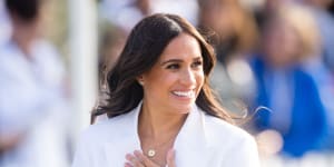 Meghan loves to play against type,pictured here,mixing a piece of hand jewellery from Catbird with a Cartier watch from Princess Diana.