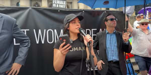 Moira Deeming speaking at an anti-trans rights rally at Parliament House on Saturday.