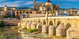 The Roman Bridge across the Guadalquivir river and the marvellous Mosque-Cathedral in Cordoba,Spain.
