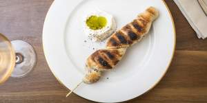 Stockbrot (bread on a stick) served with creme fraiche and pumpkin seed oil.