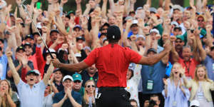 Tiger Woods celebrates after sinking his winning putt at Augusta to win the US Masters in April.