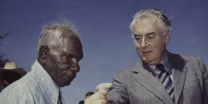 Prime Minister Gough Whitlam pours soil into the hand of traditional landowner Vincent Lingiari,Northern Territory in 1975.