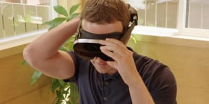 Mark Zuckerberg tries a prototype Meta headset,which uses holographic lenses to shrink complex optics into a small package. Meta said creating a consumer version would require lasers that don’t exist yet.