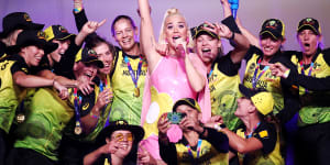 Katy Perry performs on stage with the Australian cricket team following their victory in the ICC Women's T20 cricket world cup final match against India.
