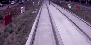 A construction worker narrowly avoids being hit by light rail.