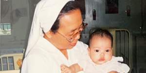 Rache Mahon as a baby with a nun at an orphanage in Quezon City,Philippines,before she was adopted.