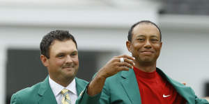 Tiger Woods dons his fifth green jacket following his remarkable win at Augusta National last year.