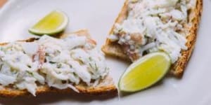 Mud crab with fresh herbs on toast.