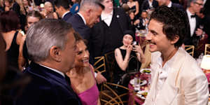 Timothée Chalamet with (left) Netflix boss Ted Sarandos and (centre) his mother,former ballet dancer Nicole Flender.