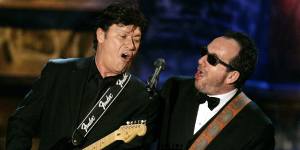 Robertson and Elvis Costello perform during an all-star tribute to New Orleans at the end of the 2006 Rock and Roll Hall of Fame induction ceremonies at the Waldorf Astoria Hotel in New York.