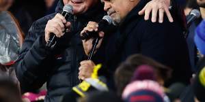 Former Essendon coach Kevin Sheedy and Michael Long perform at half-time of the 2023 Dreamtime match at the MCG.
