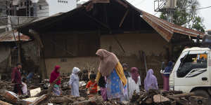 People inspect the damage in Tanah Datar,West Sumatra,Indonesia.