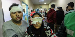 Palestinians injured in Israeli airstrikes arrive at Nasser Medical Hospital in Khan Younis,Gaza. 