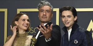 Adapted screenplay Oscar winner Taika Waititi (centre),with Natalie Portman and Timothee Chalamet,at the Oscars.