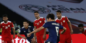 Japan progress,Qatar's Ali equals record in North Korea thrashing